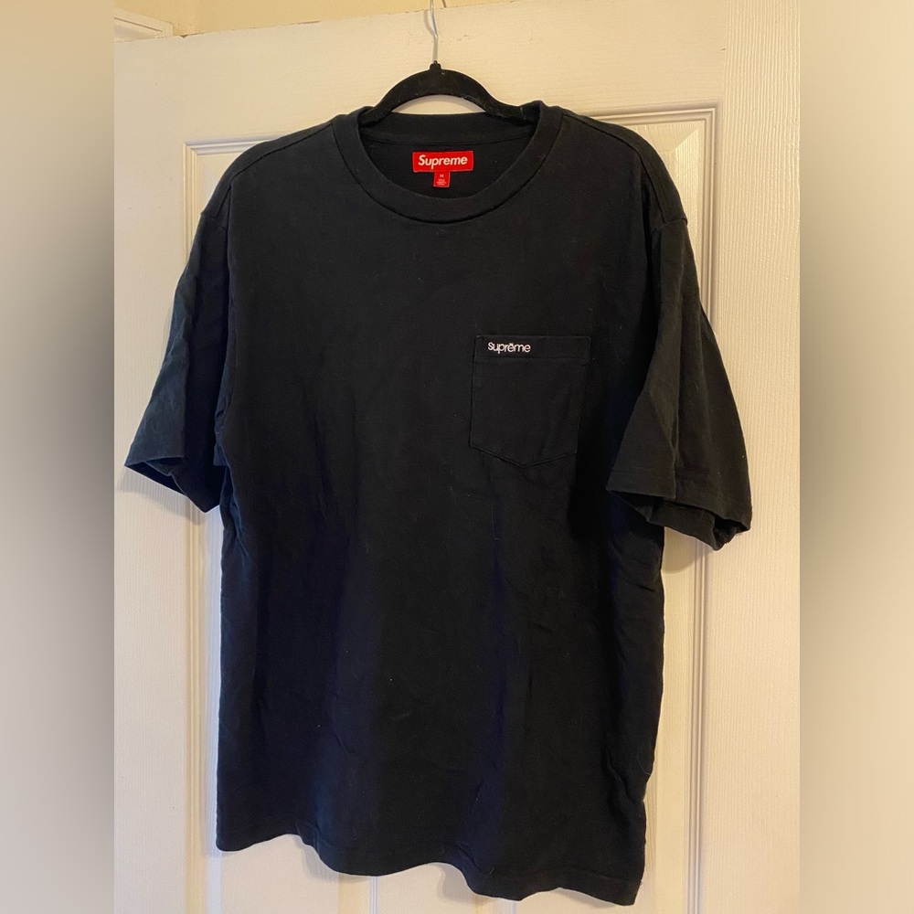 Supreme T shirt with original bag.